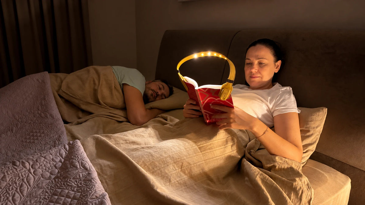 Reading with Bowio 3 beside a sleeping partner