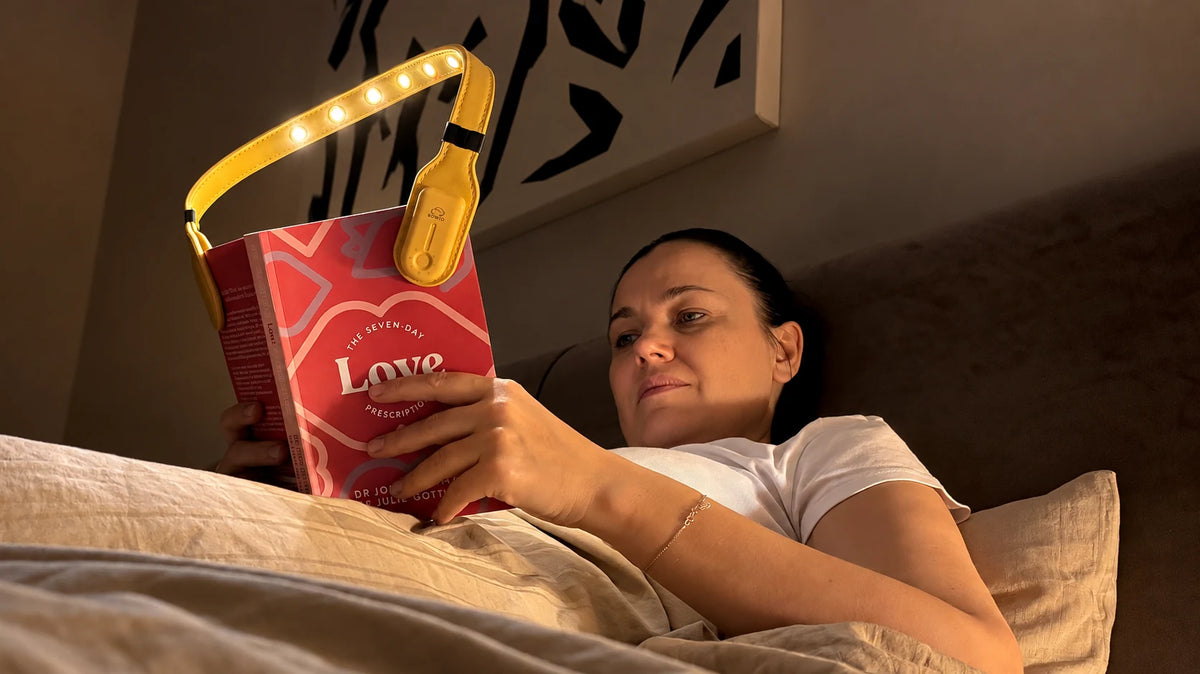 Bowio 3 casting a warm light over a book during bedtime reading